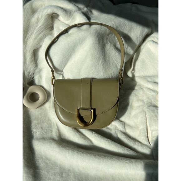 CHARLES & KEITH’s signature Gabine leather saddle bag - Picture 1 of 4